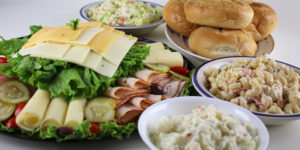 Platter, cold salads and rolls from Adams Deli
