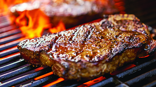 Bone-in NY Strips on grill