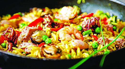 Paella in black skillet